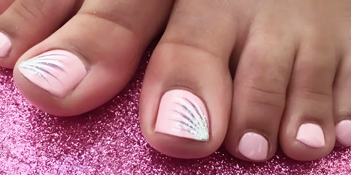 Pretty pink pedicure with glitter nail art